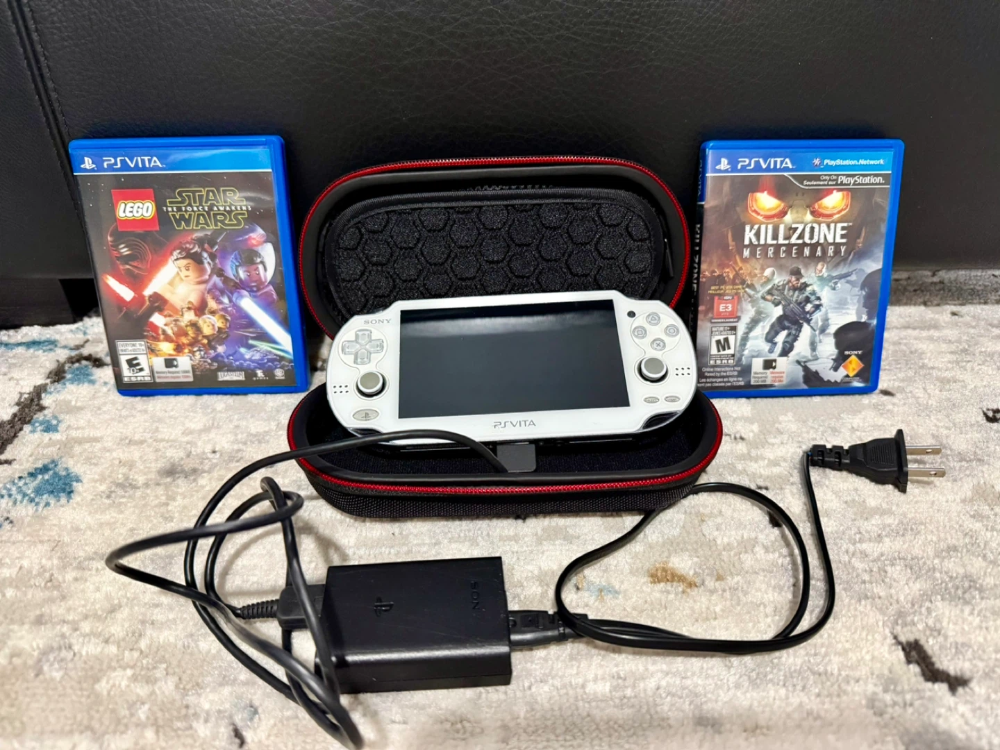 Sony PlayStation Vita 1000 and two games