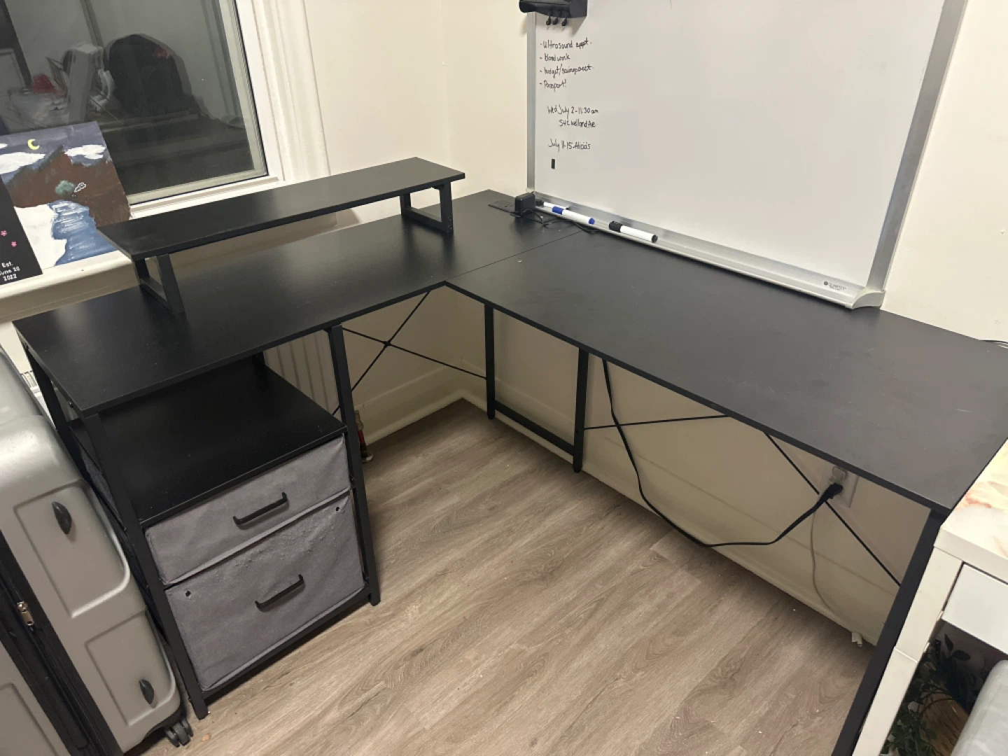 Black L-Shaped Desk with Built-in Power Outlets