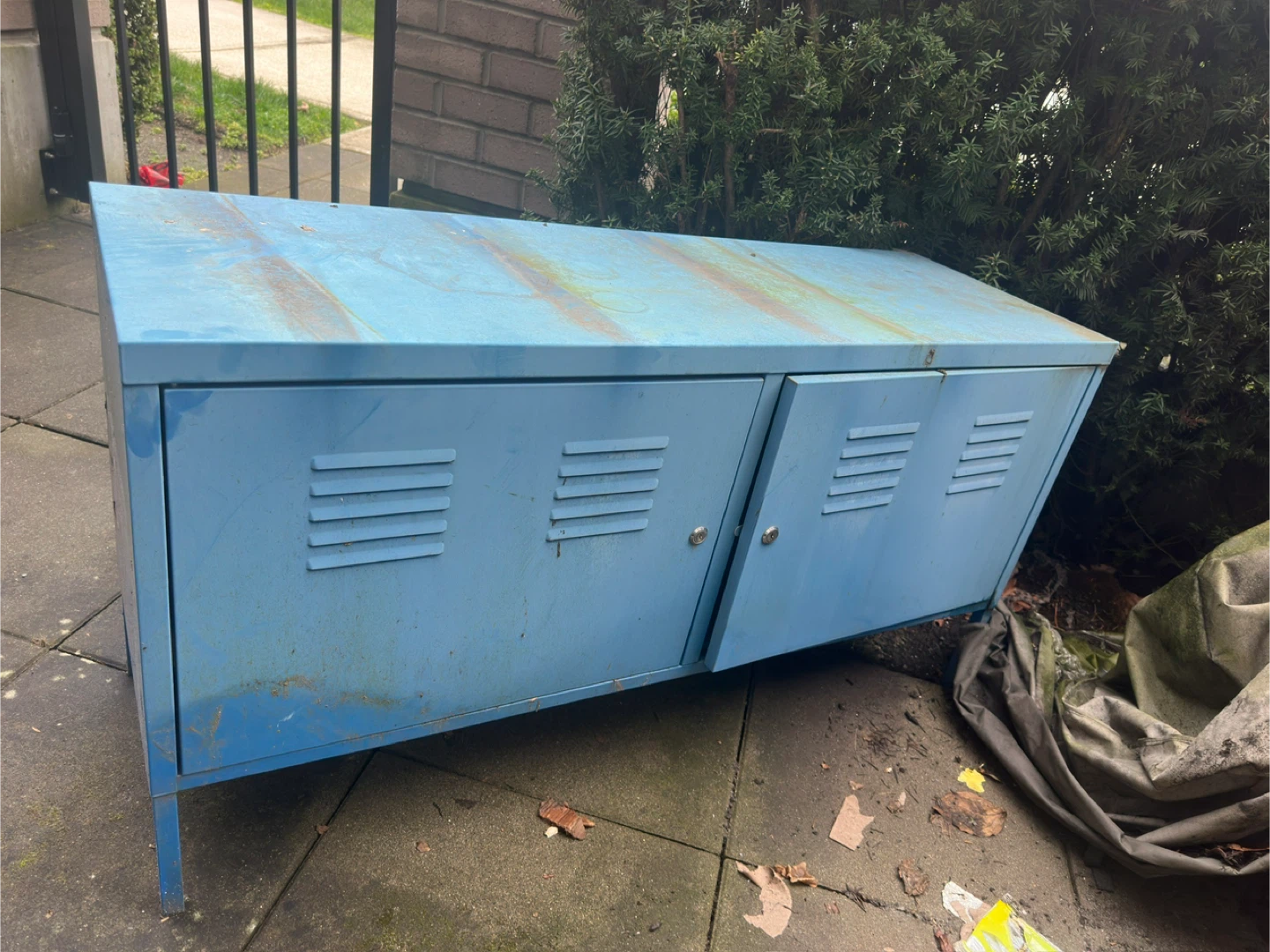 Blue metal storage cabinet with double doors