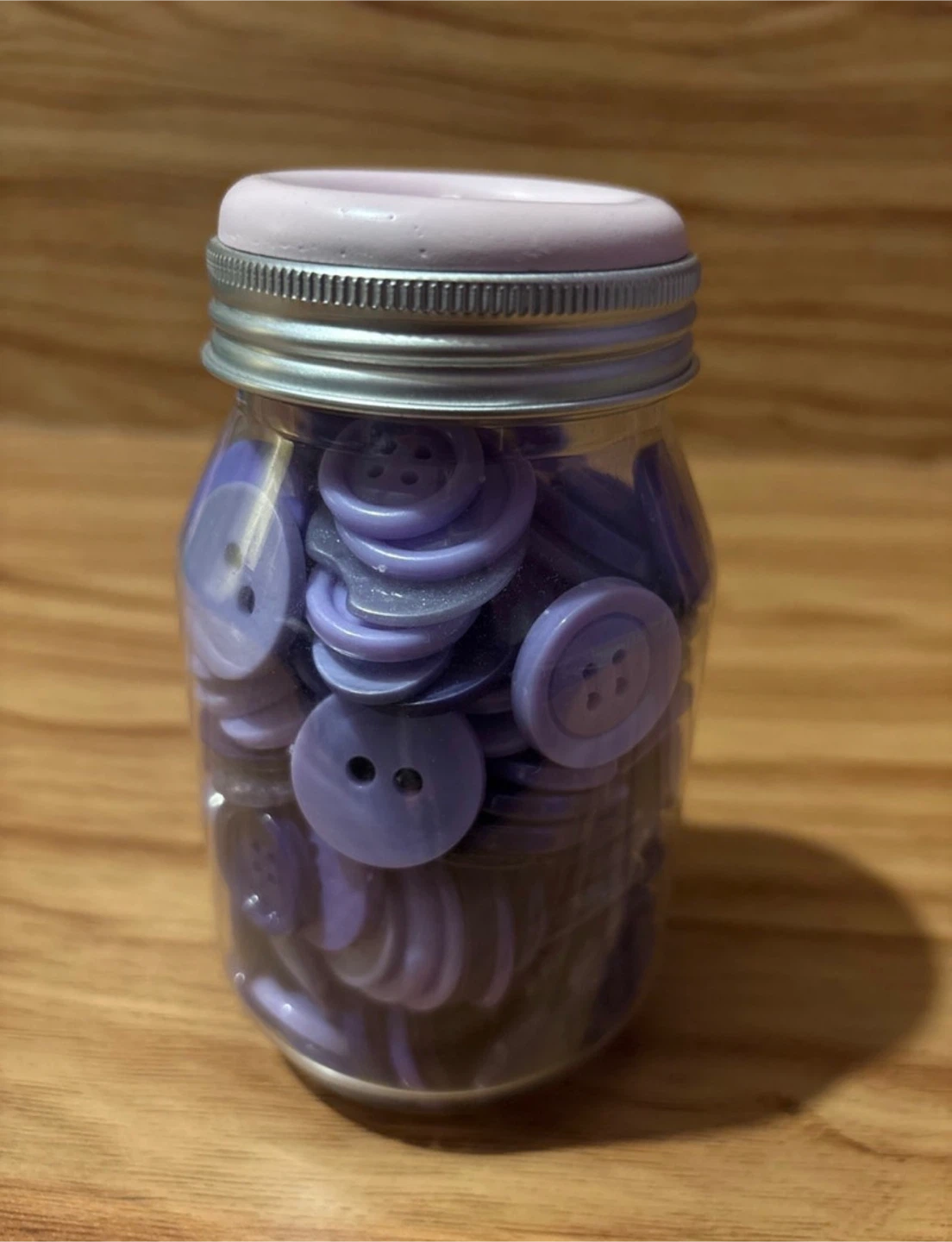 Jar of purple buttons
