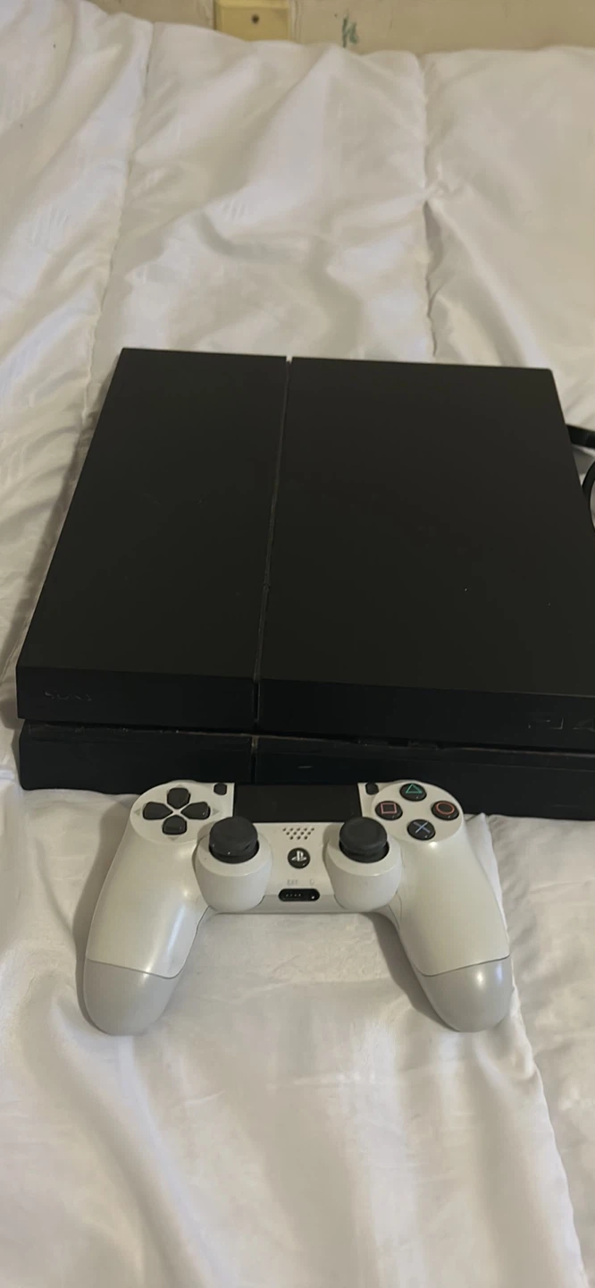 PlayStation 4 Console with White Controller and power Cables