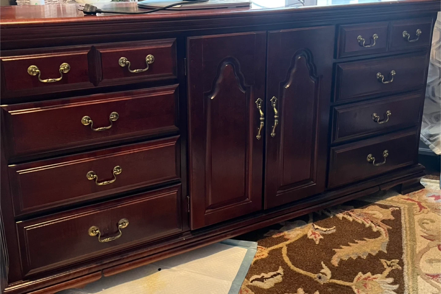 Dark Wood Dresser with Multiple Drawers and Cabinets