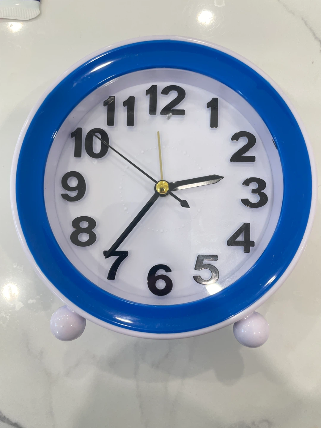 Blue and White Analog Alarm Clock