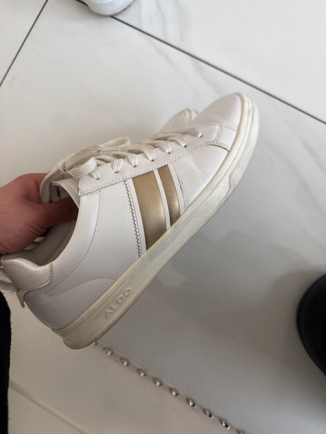 White ALDO Sneakers with Gold Stripes