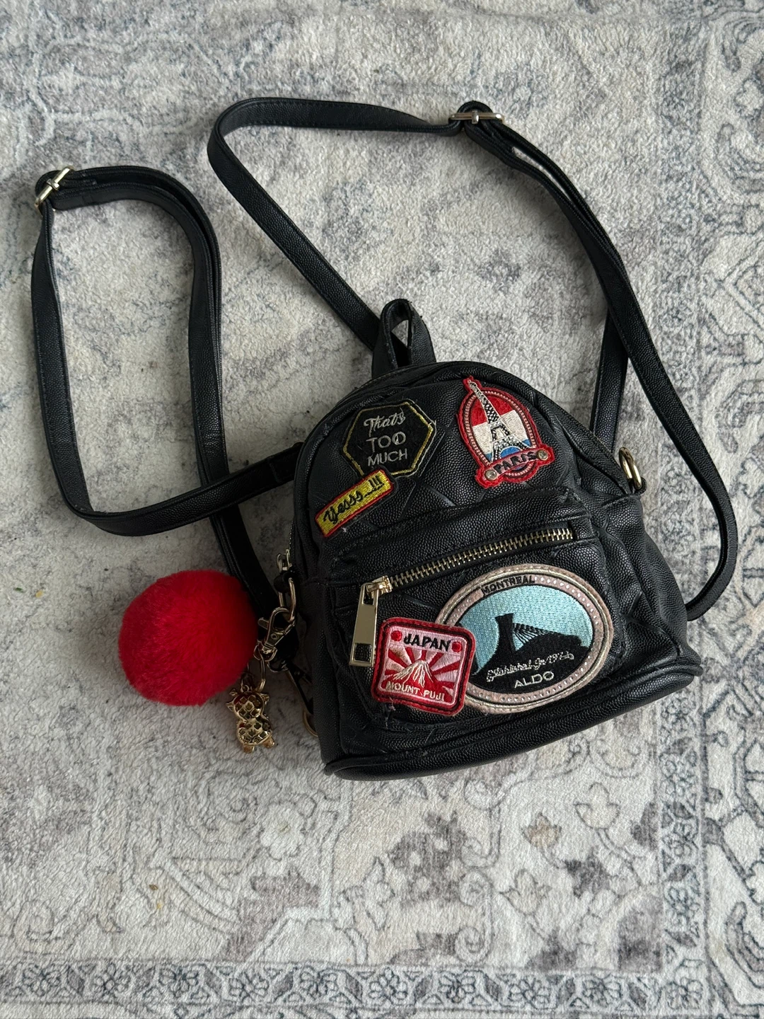 ALDO Black Mini Backpack with Pom Pom Charm