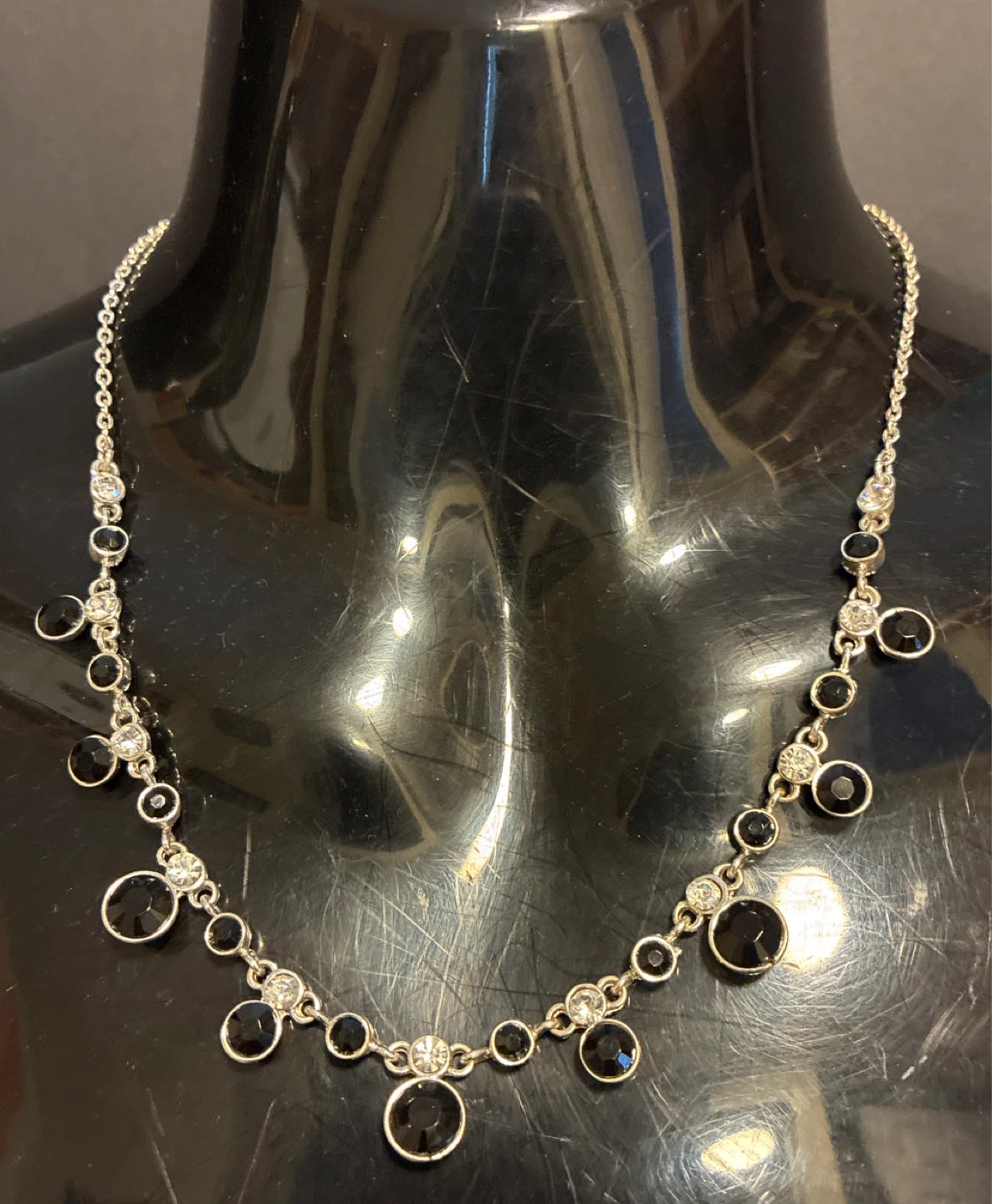 Silver-tone necklace with black and clear stones