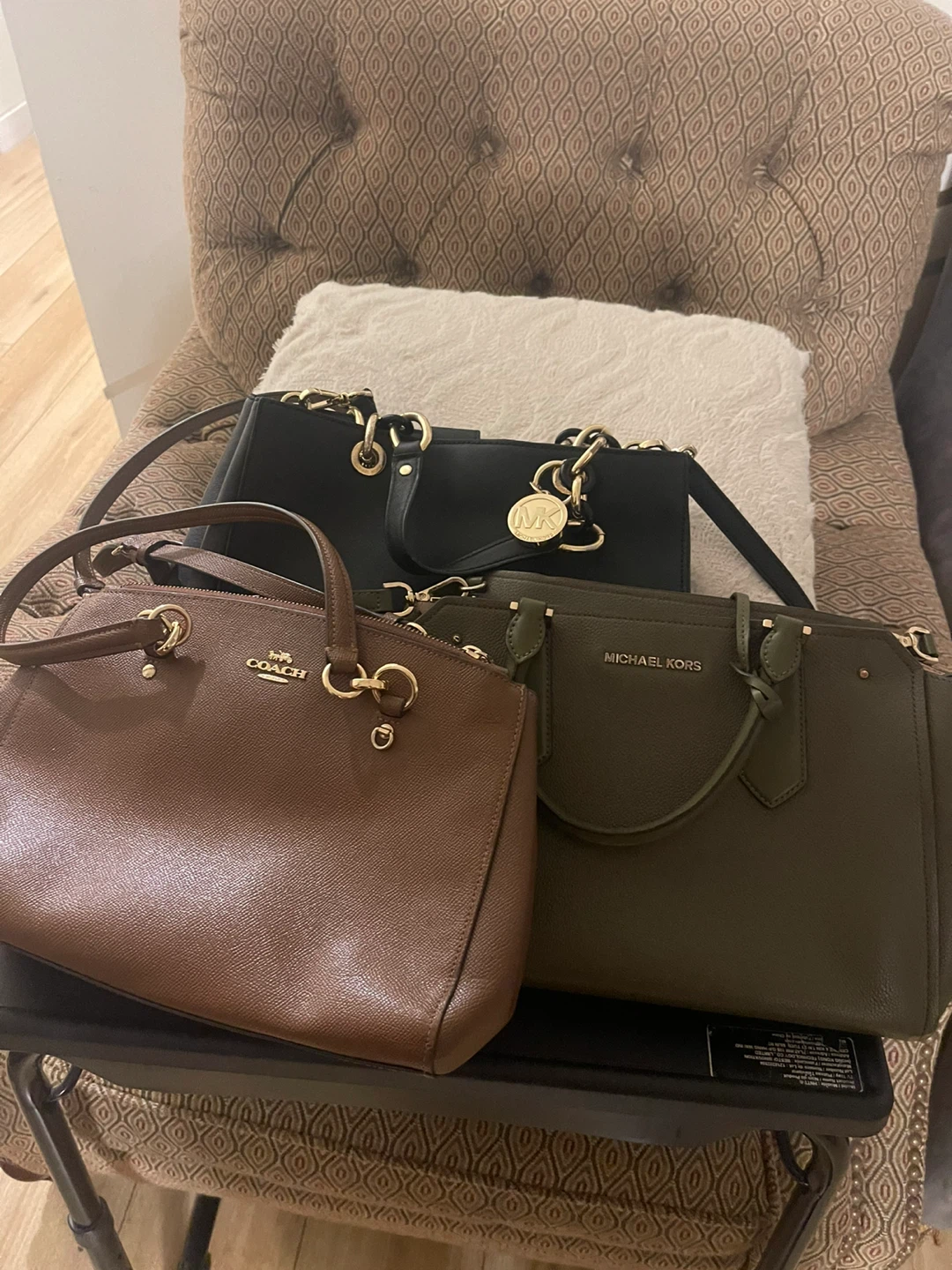 3 bags, 2 Michael Kors, n 1 coach