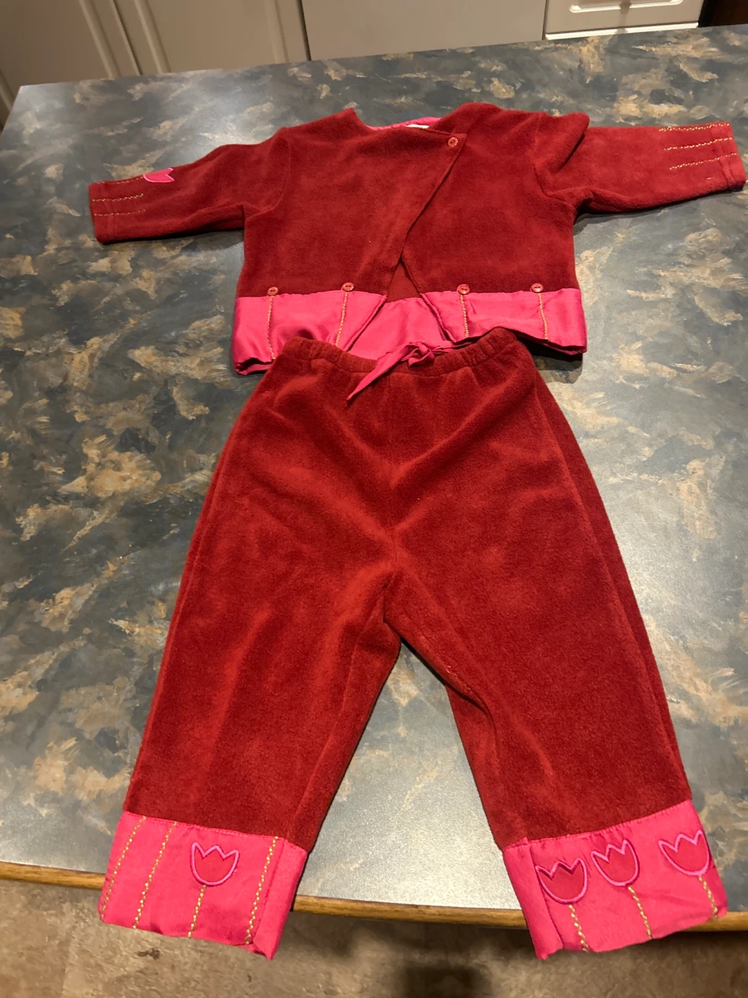 Red velour outfit with pink tulip trim