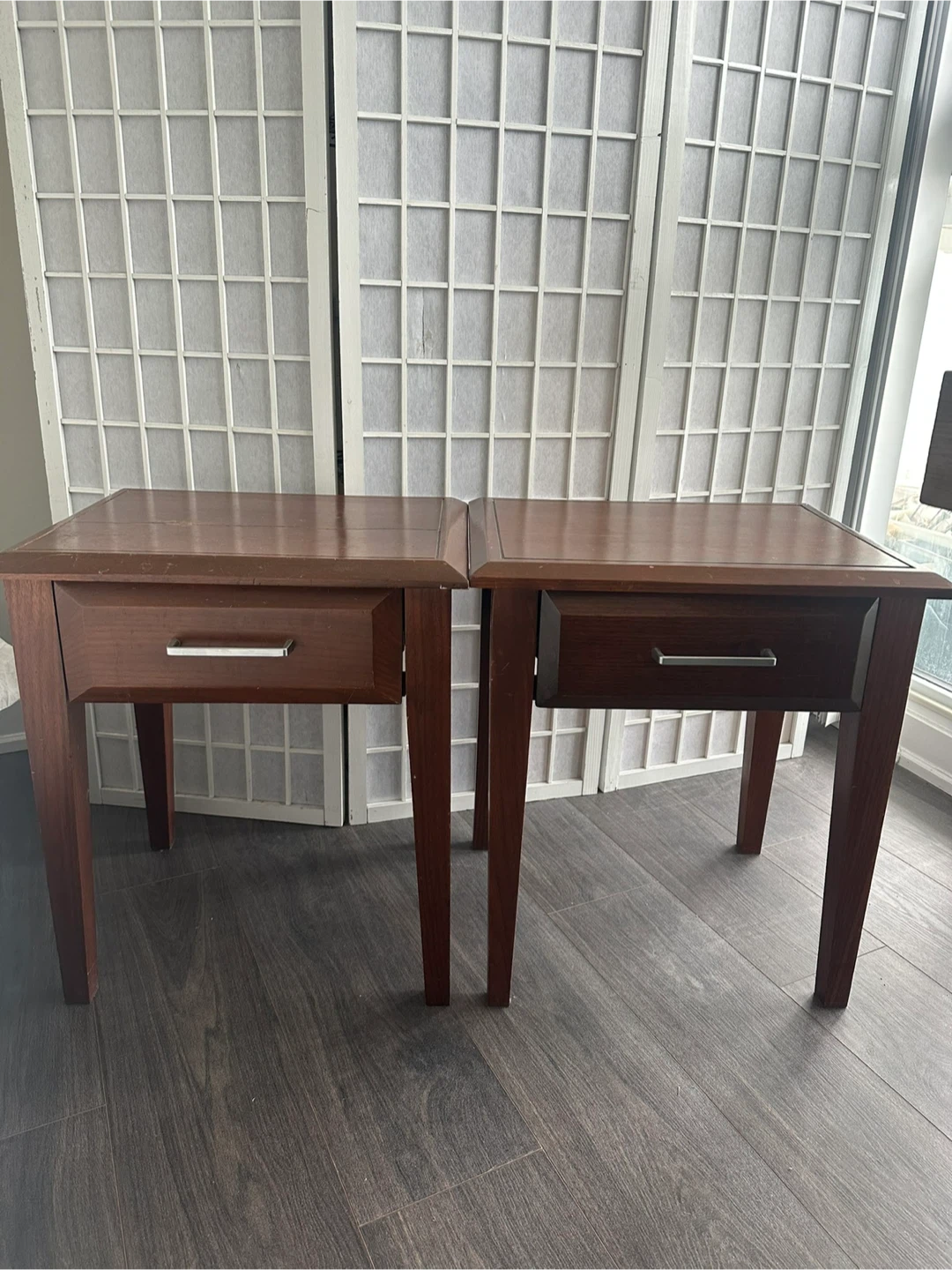 Two dark wood end tables with drawers