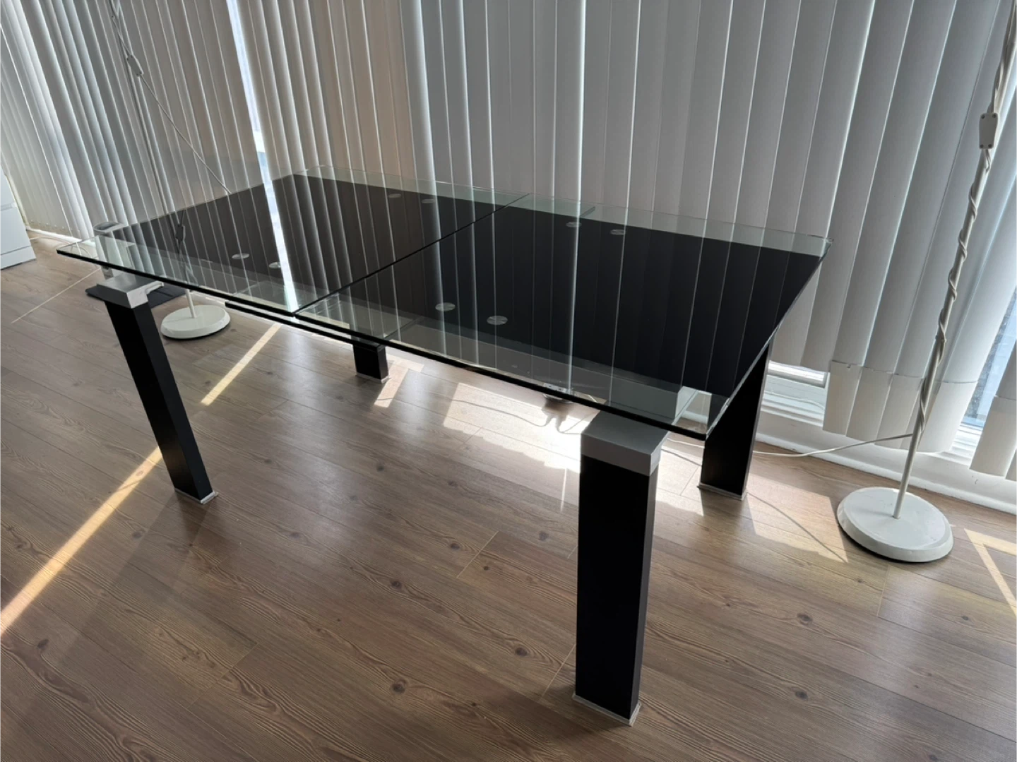 Moving sale- Extendable Glass Top Dining Table with Black Legs - photo 2