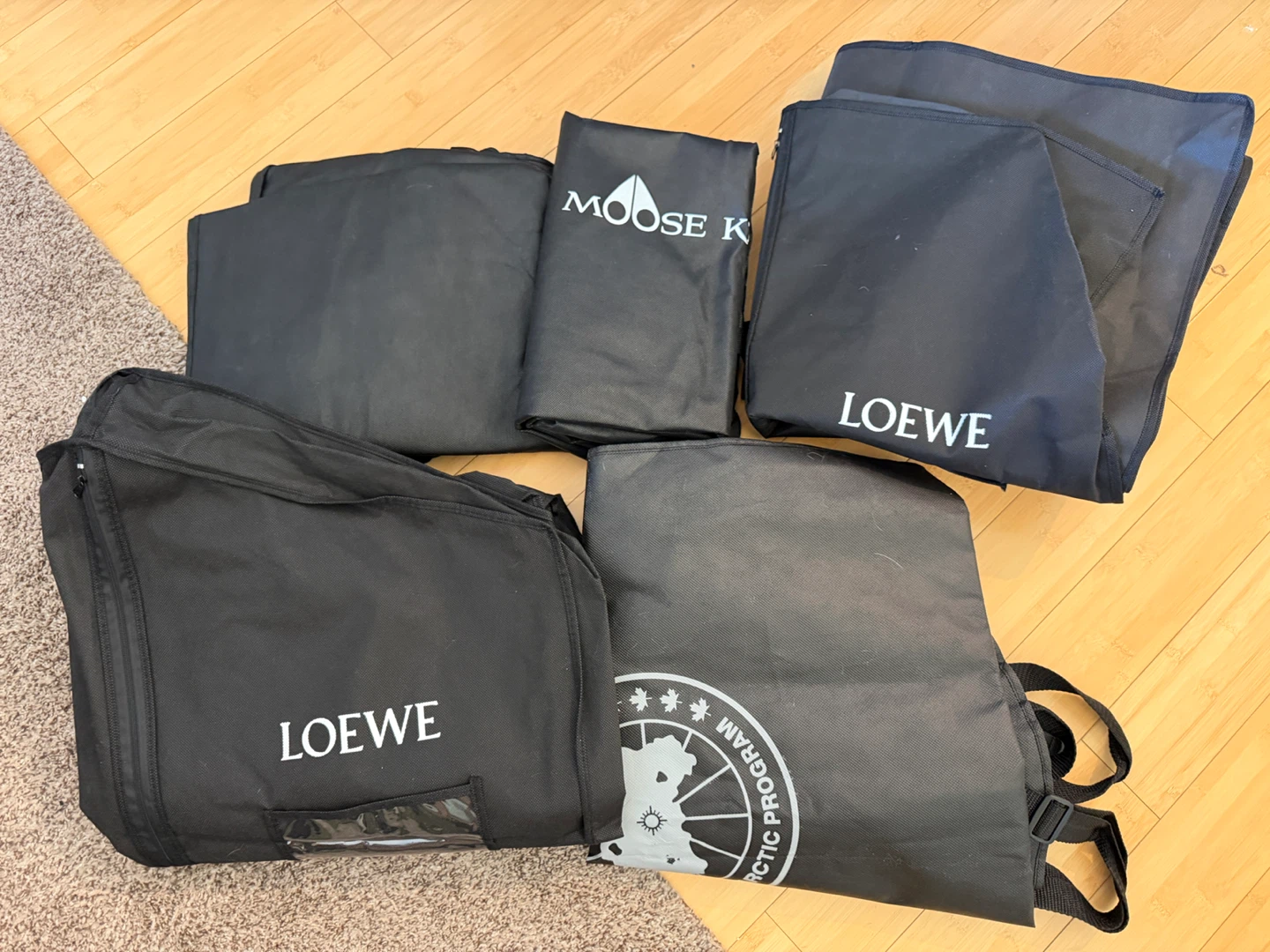 Lot of 5 Garment Bags: Loewe, Moose Knuckles, Canada goose