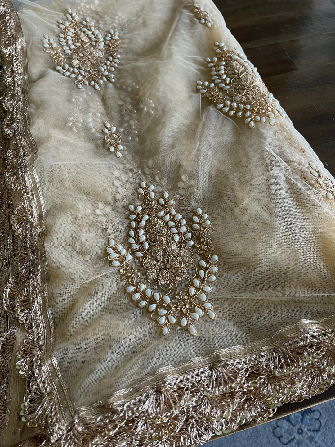 Hand crafted with gold Thread and pearl.