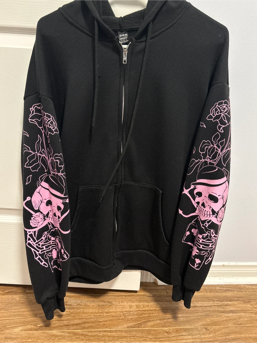 Black Zip-Up Hoodie with Pink Skull Graphics