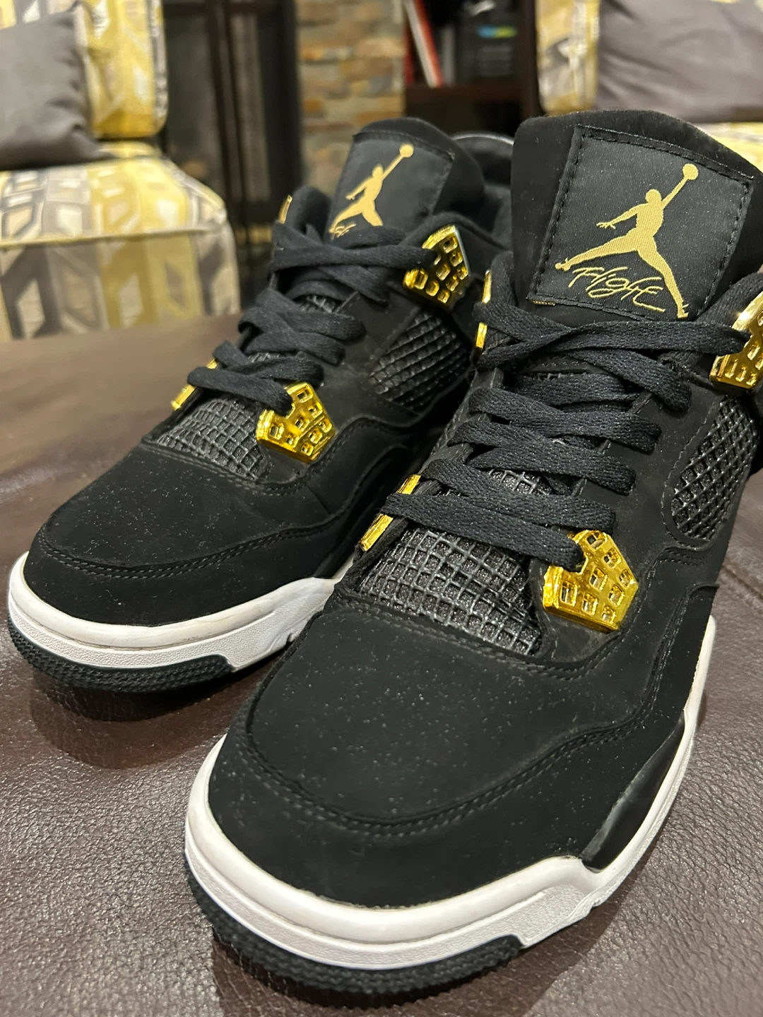Air Jordan 4 Retro Sneakers - Black and Gold
