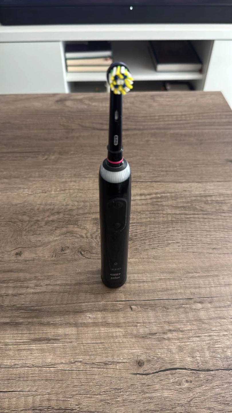 Oral-B Electric Toothbrush with Charger and Case