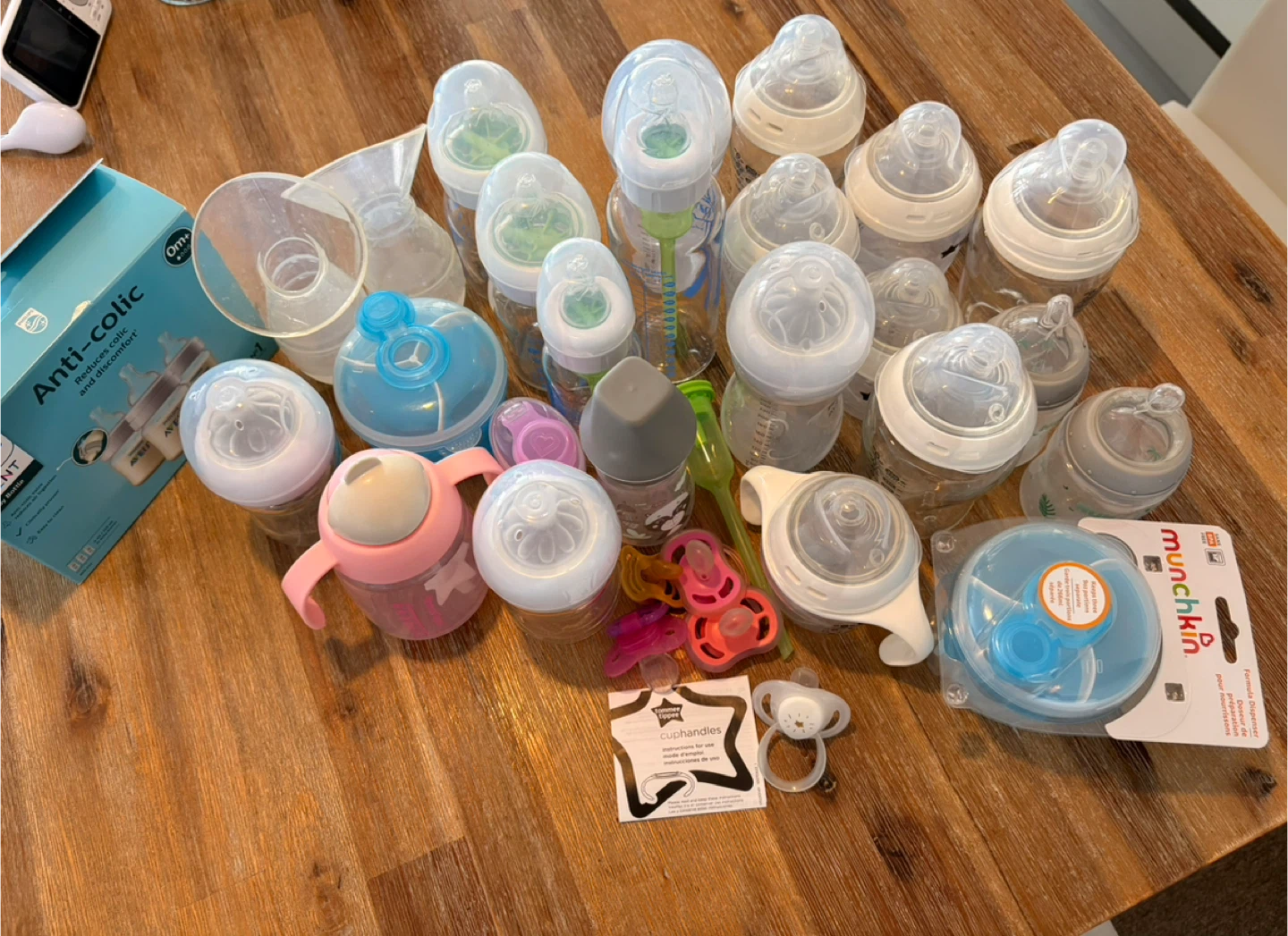 Assorted Baby Bottles, Pacifiers, and Accessories