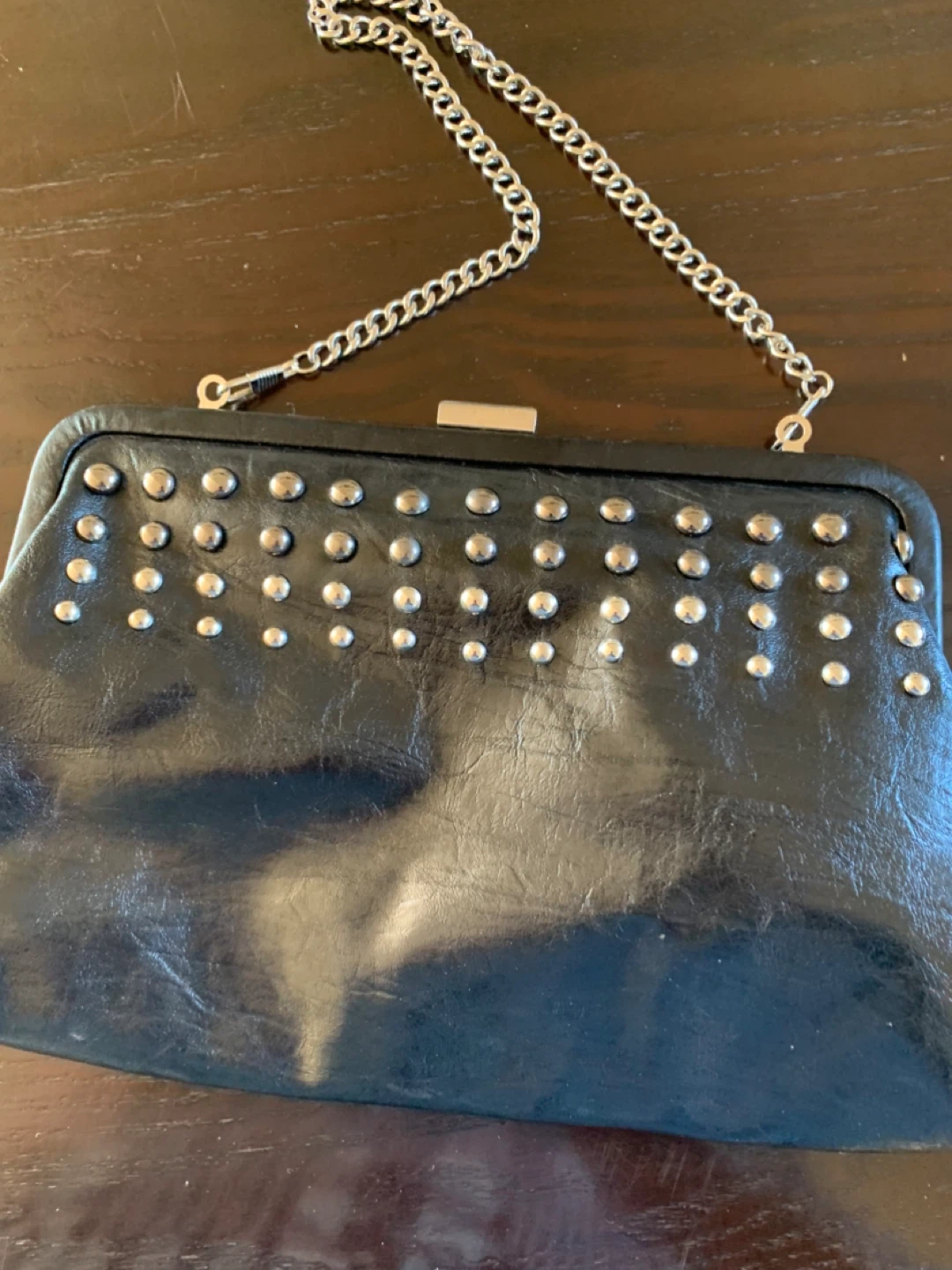 Black clutch with chain and studs