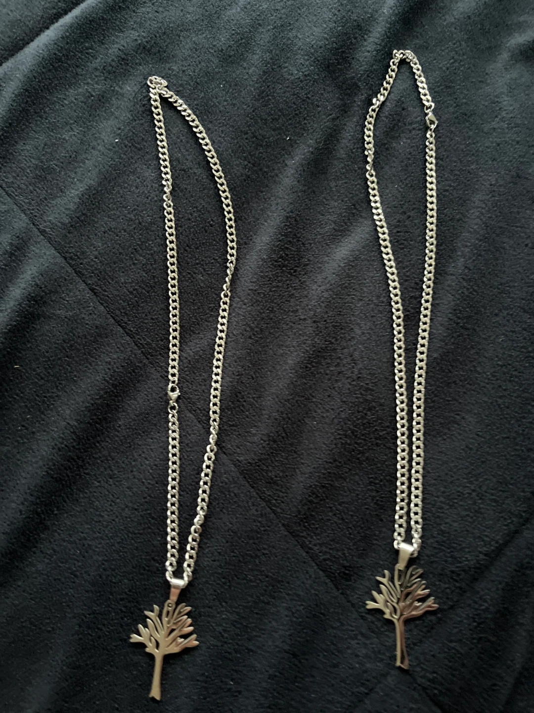 Two poison tree necklaces