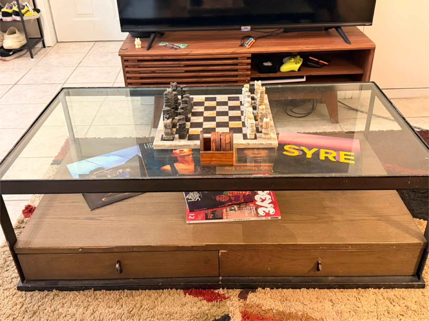 Glass top coffee table with drawers