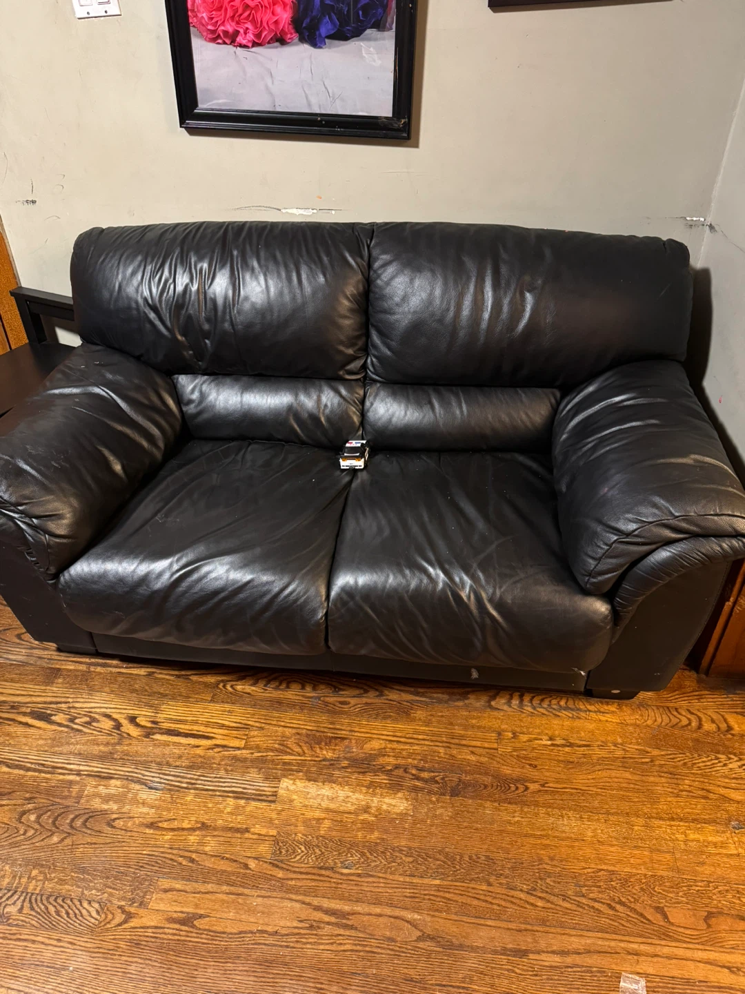 FREE!! I have two Black Leather Loveseat