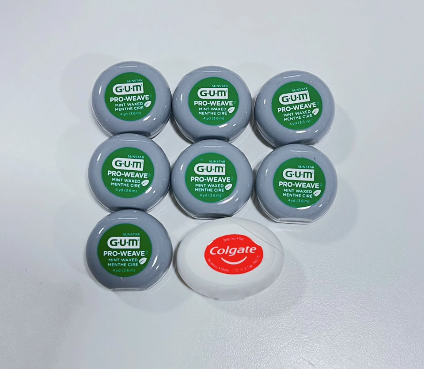 7 GUM Pro-Weave Mint Waxed Floss & 1 Colgate Floss