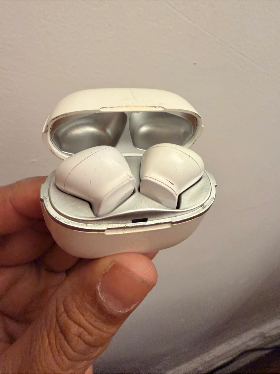 Used White Wireless Earbuds Charging Case