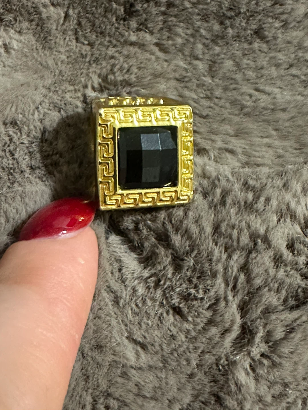 Gold-toned ring with black square stone