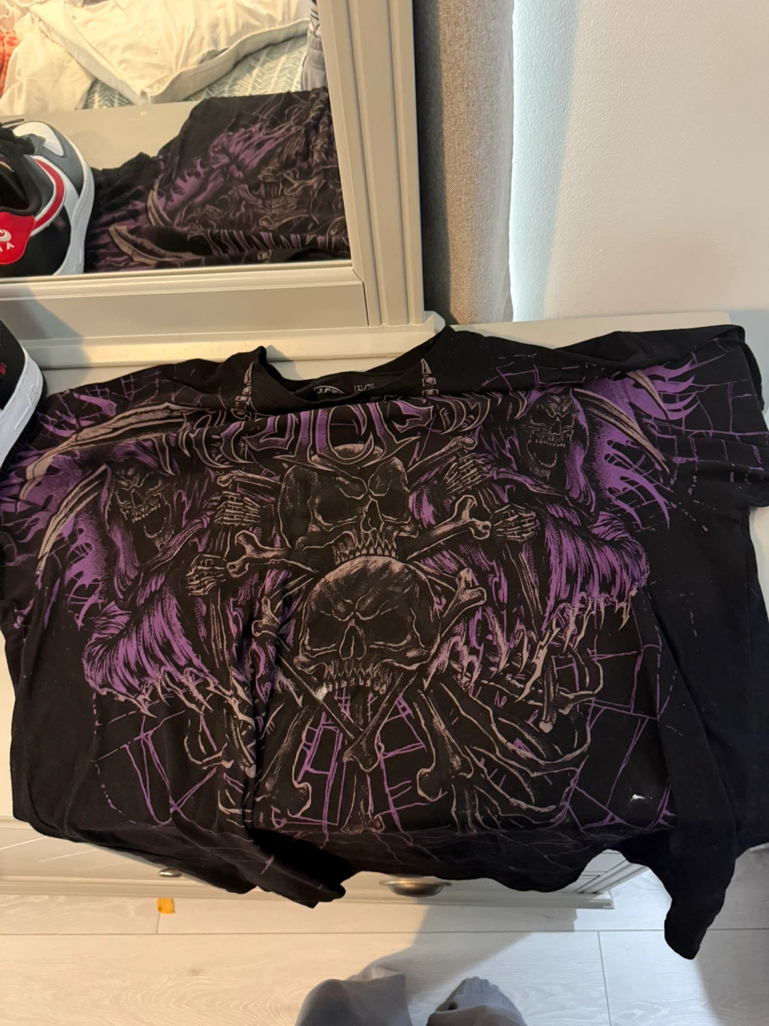 Black Graphic T-Shirt with Skulls and Purple Accents