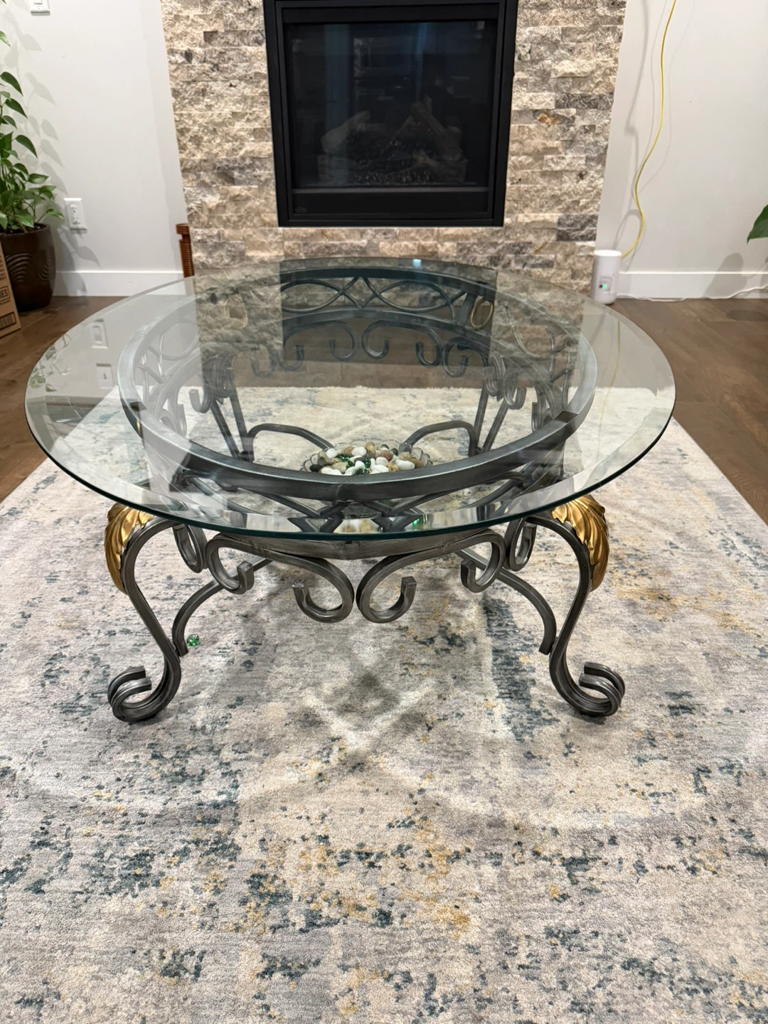 Oval Glass Top Coffee Table with Ornate Metal Base