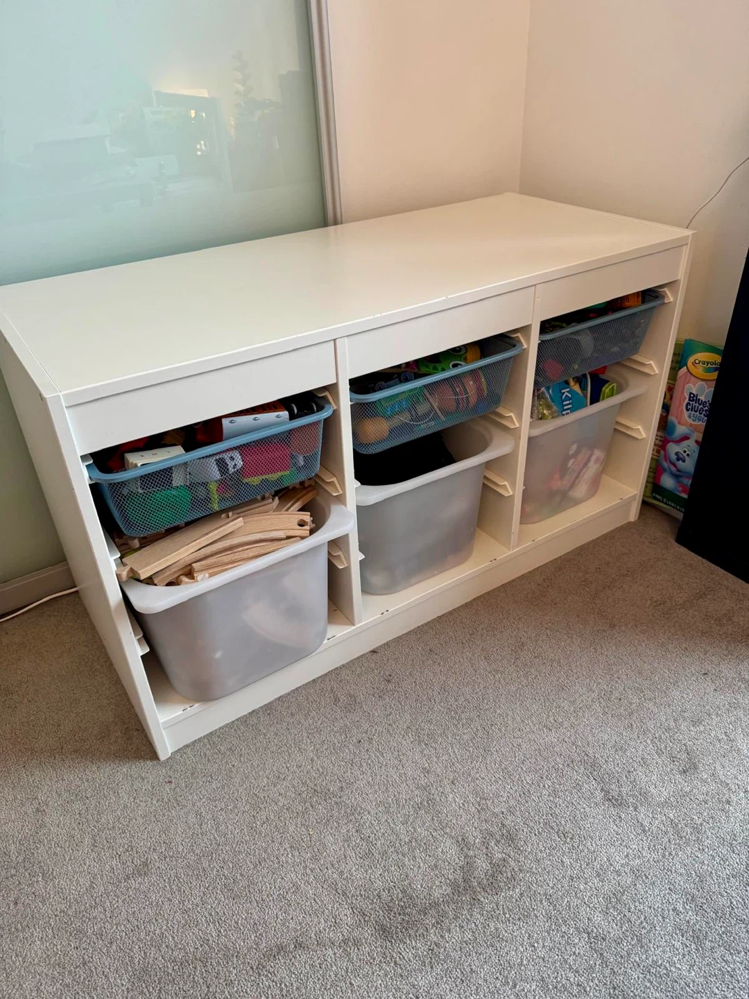 White Toy Storage Unit with Baskets and Bins