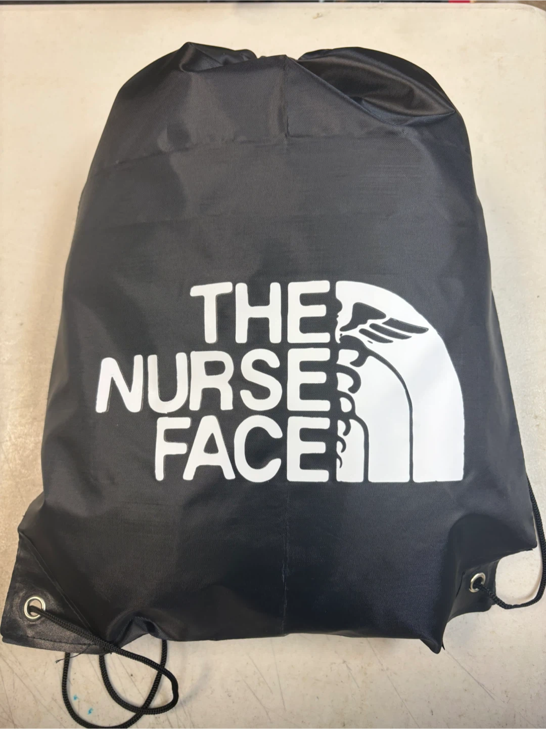$15 ( The Nurse Face Drawstring Bag )