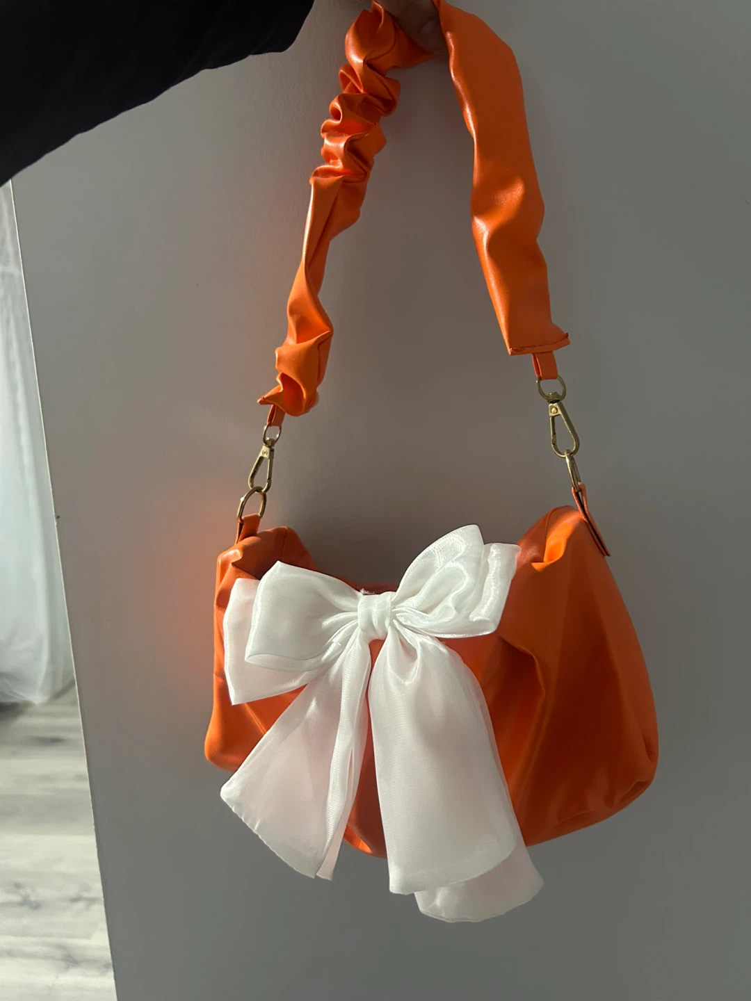 Orange Ruched Handbag with White Bow Accent