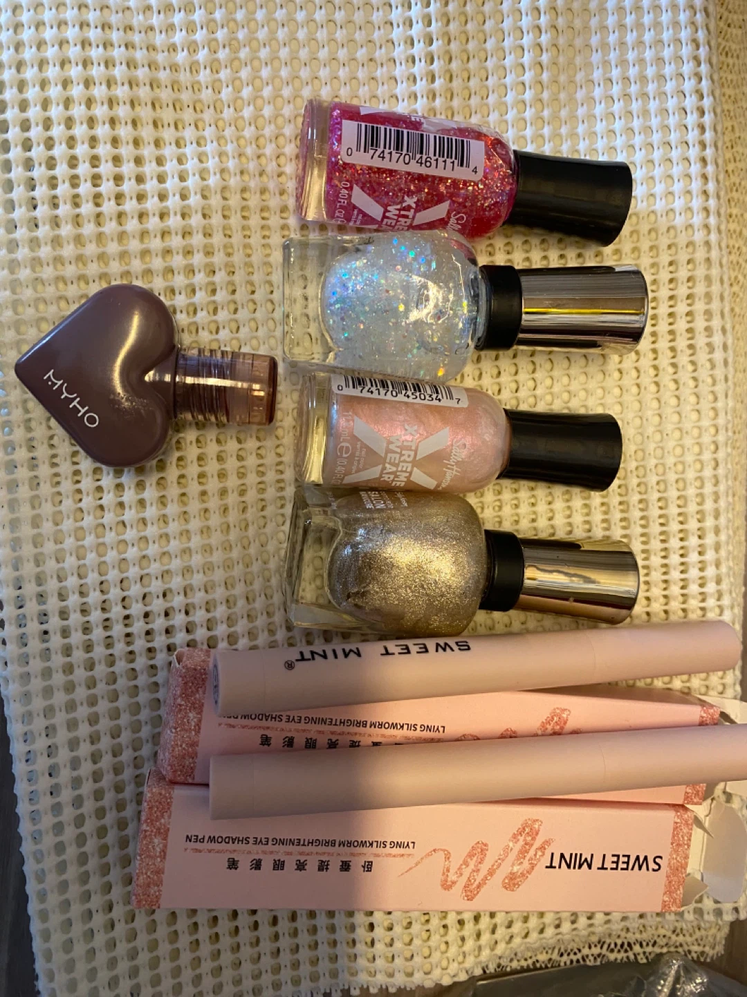 Various nail polish lip gloss eye makeup