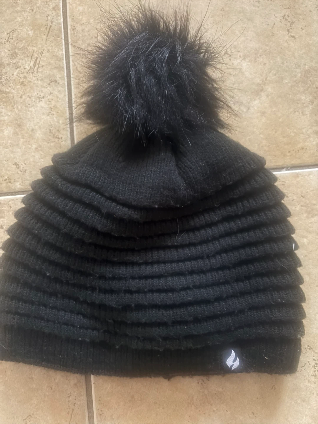 Black toque with faux fur pom-pom