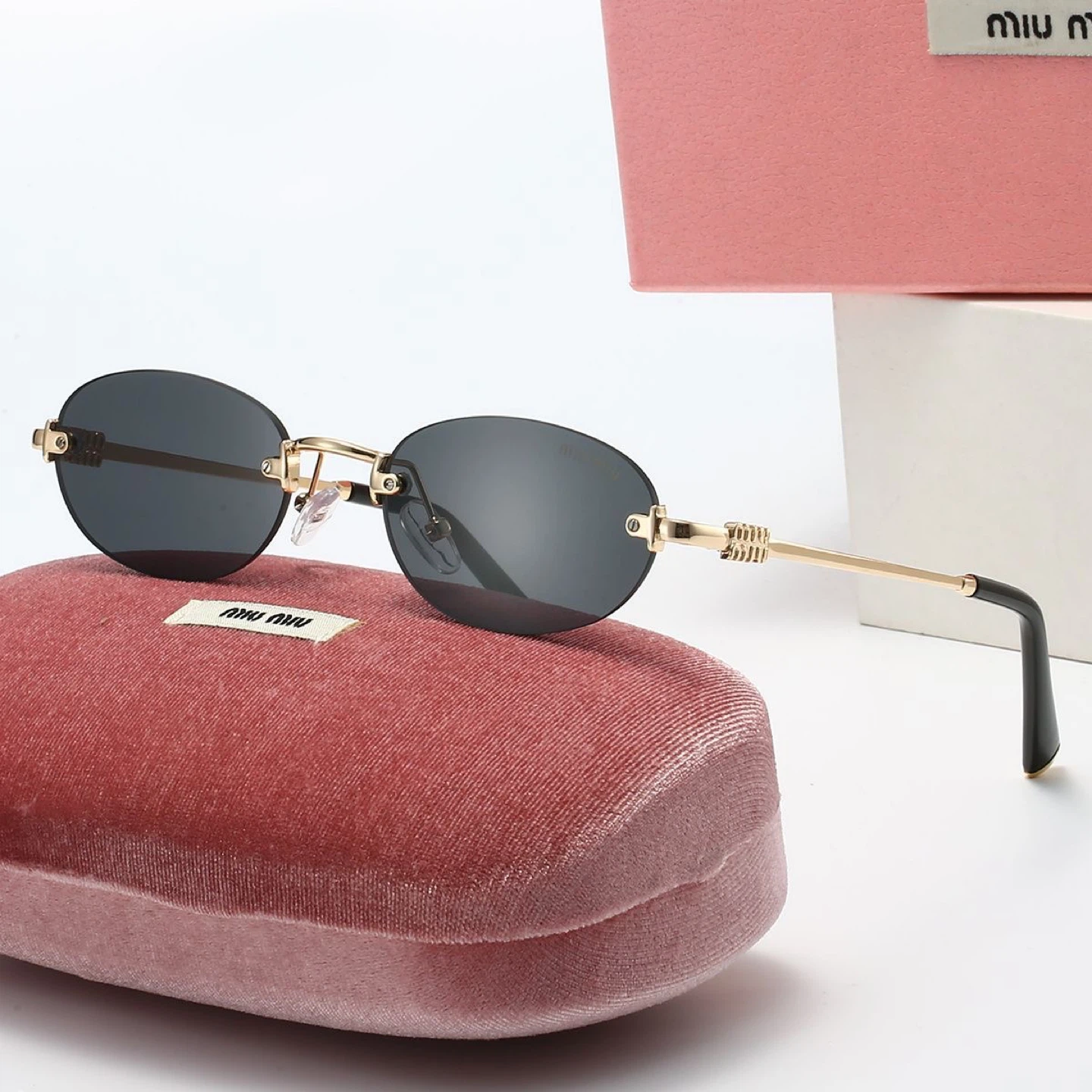 Miu Miu Oval Rimless Sunglasses