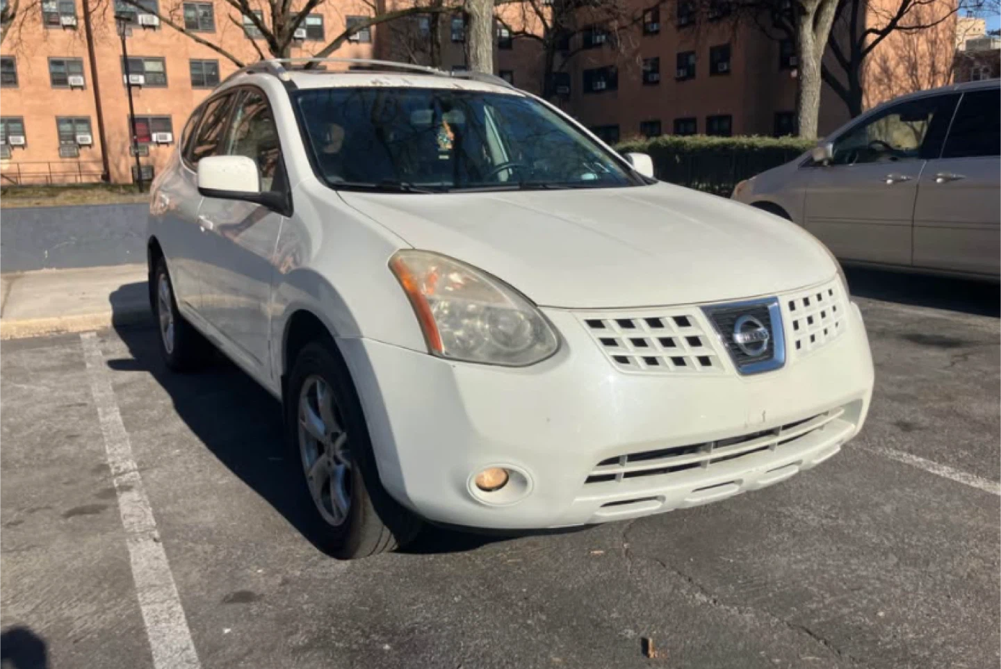 White Nissan Rogue SUV - photo 2