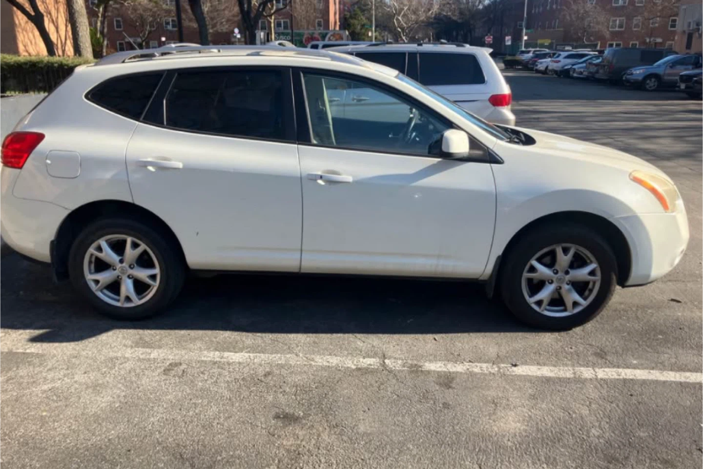 White Nissan Rogue SUV - photo 3