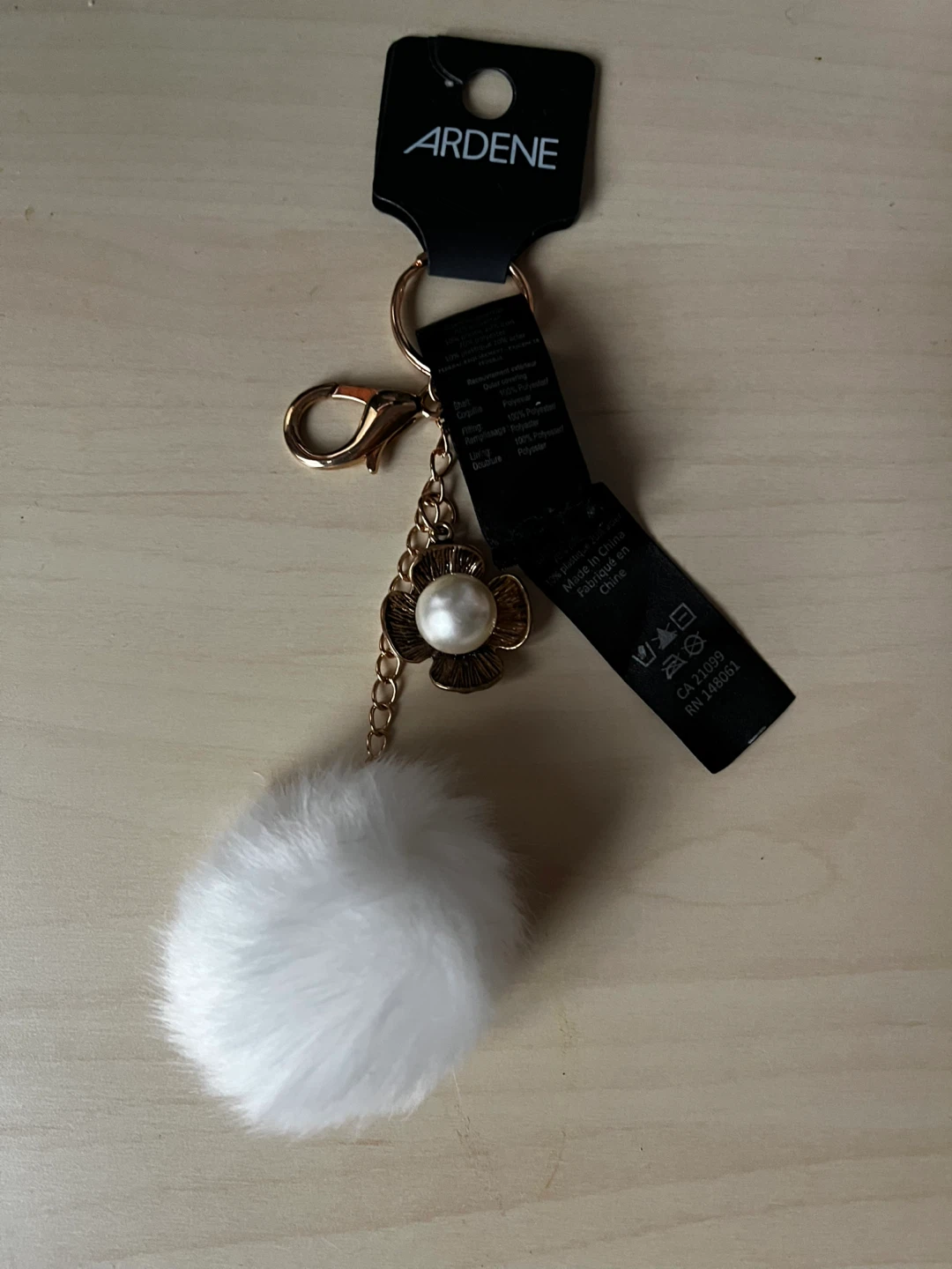Ardene White Faux Fur Pom Pom Keychain with Pearl Flower Charm