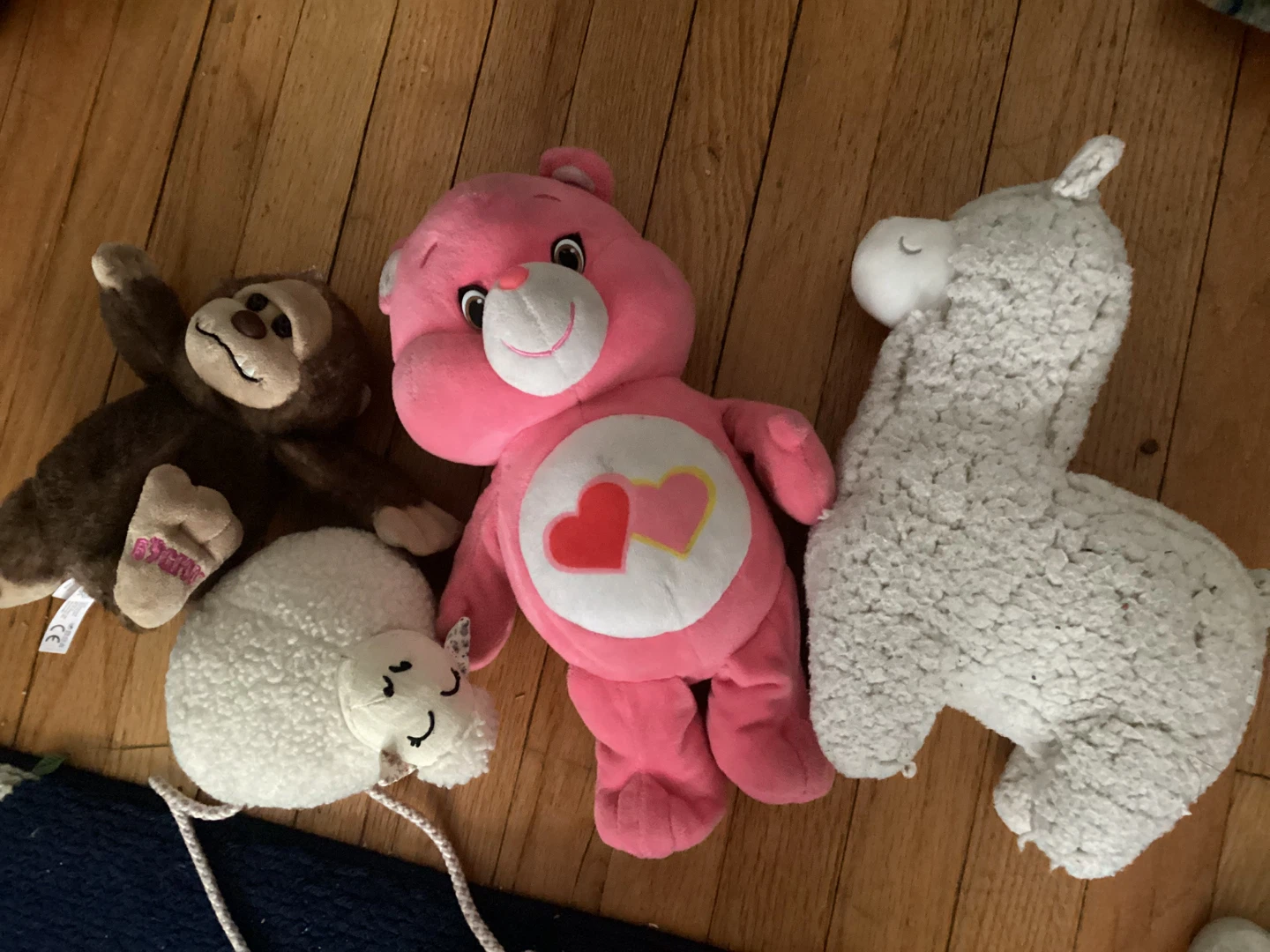 Care Bear, Monkey, Sheep, and Llama Plush Toys