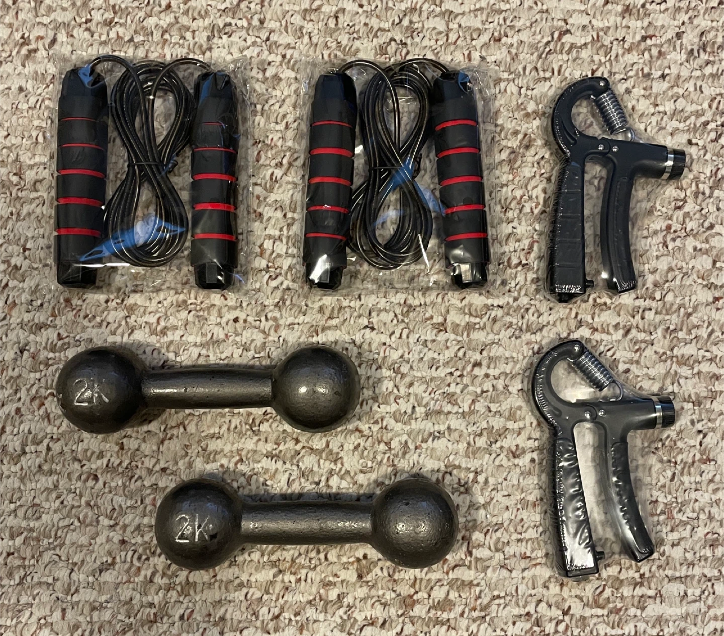 Dumbbells, hand grips and rope jumpers