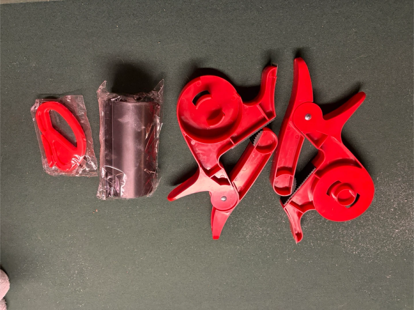 Red Plastic Seal Clamps and Roll Holder