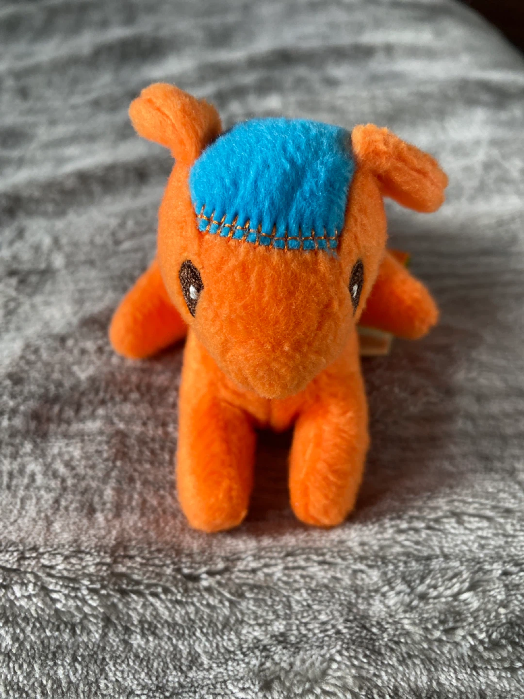 Orange Plush Toy with Blue Accent