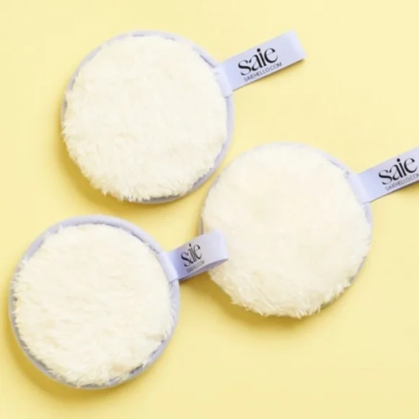 3 Saie Reusable Beauty Rounds removing makeup & applying toner