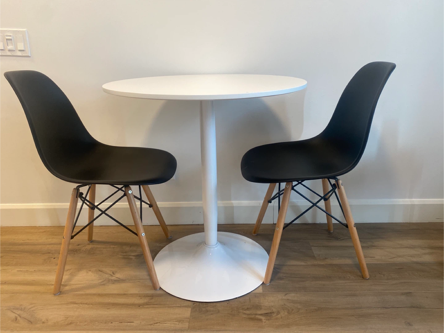 White Round Pedestal Dining Table and Two Chairs