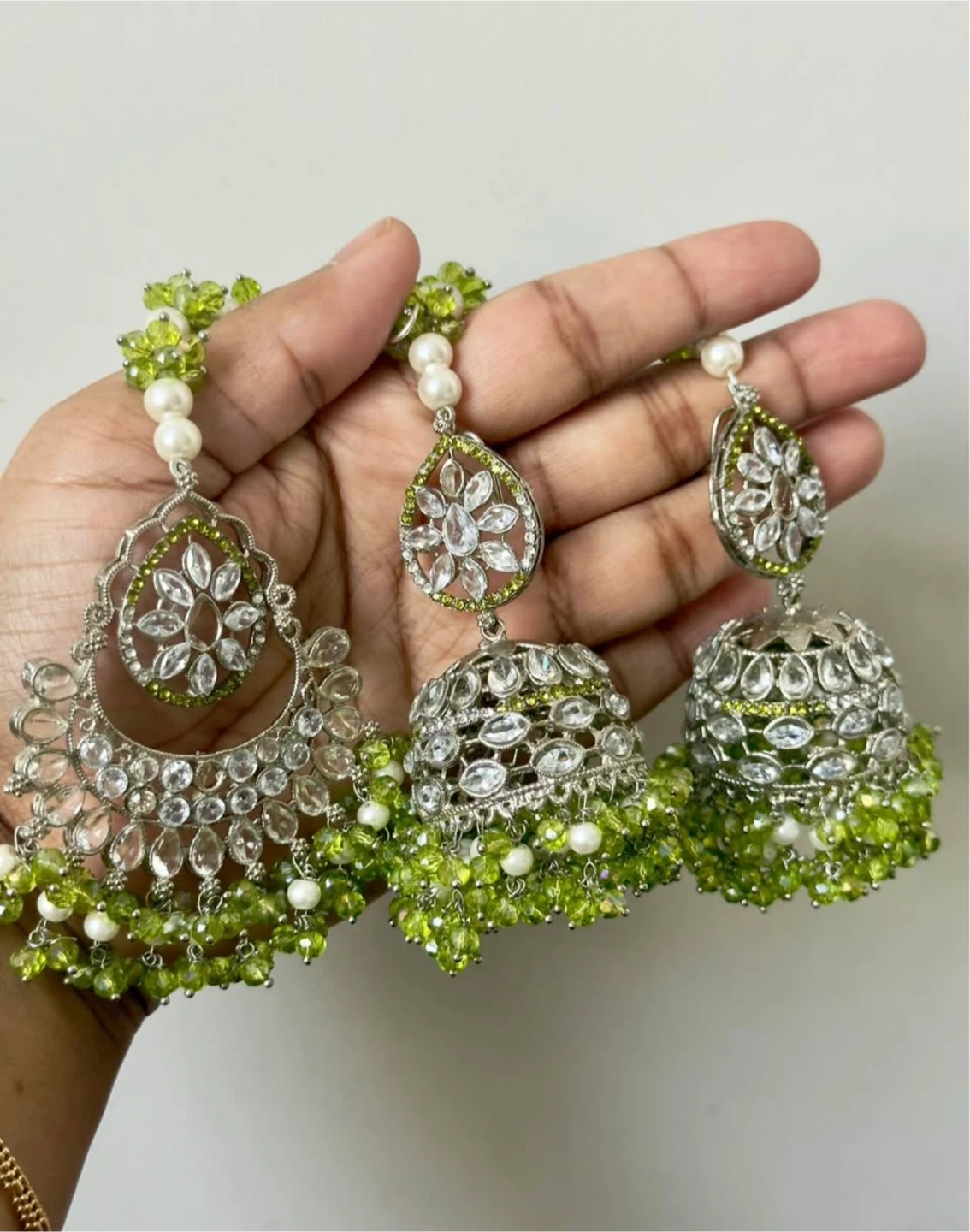 Silver Tone Jhumka Earrings with Green Beads and Crystals