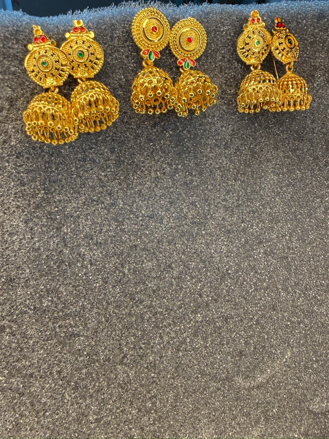 Gold Jhumka Earrings with Red and Green Stones