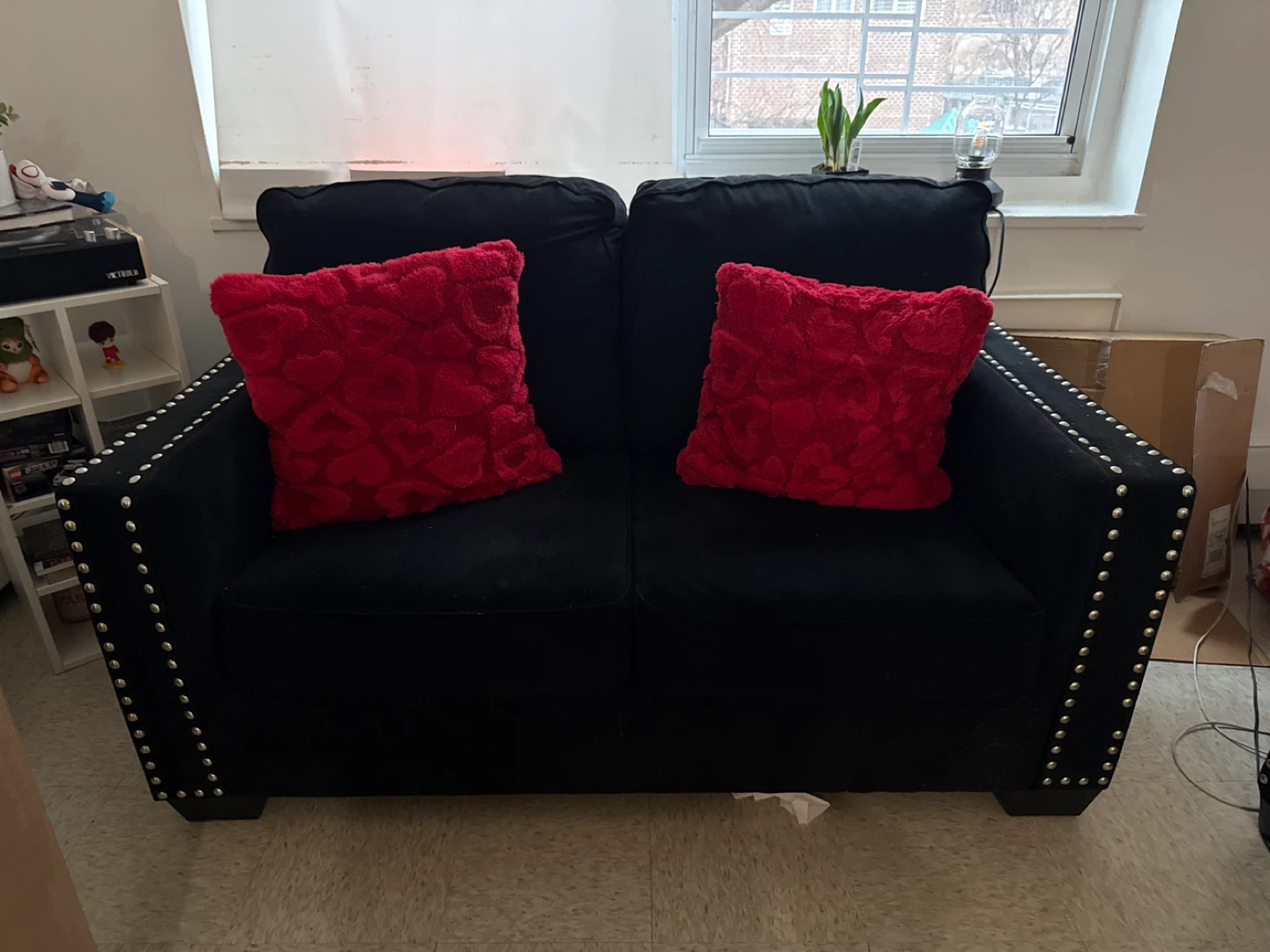 2 black sofas.