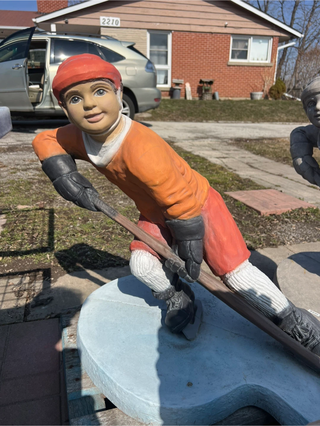 Concrete Hockey Player Statue