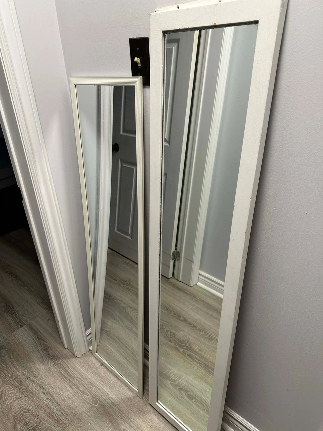 Two White Framed Mirrors