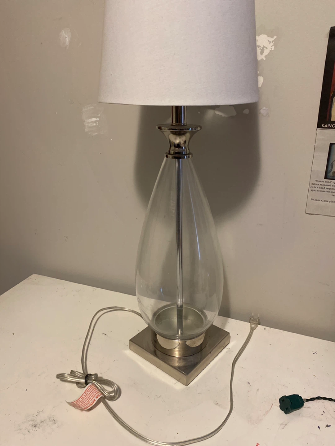 Clear teardrop table lamp with silver base